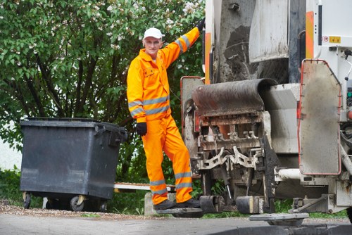 Technician handling hazardous waste materials